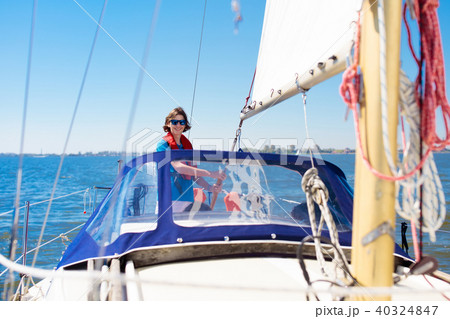 Young man sailing. Teenager boy on sea sail boat. 40324847
