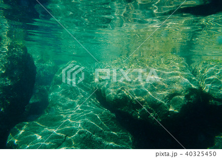 Green and blue tone of underwater rocky background Green and blue tone of underwater rocky background 40325450