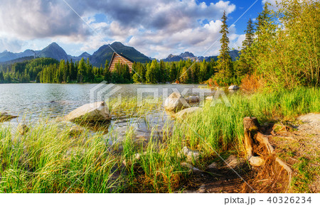 The sunrise over a lake in the park High Tatras. Shtrbske Pleso, 40326234