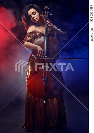 The cellist girl performs on stage. The cellist girl performs on stage. 40326697