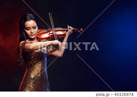 Violinist girl performs on stage. Violinist girl performs on stage. 40326978