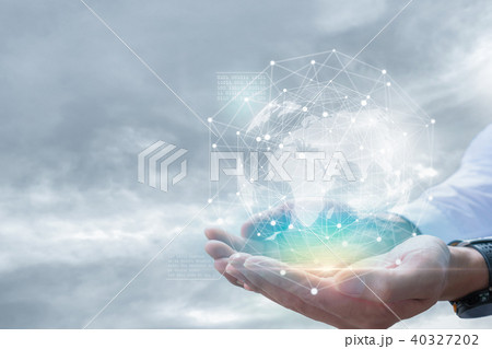Businessman holding in hand with global connection Businessman holding in hand with global connection 40327202