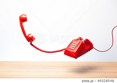 Vintage red telephone receiver Vintage red telephone receiver 40328548