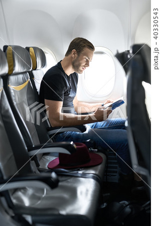 Young guy in airplane Young guy in airplane 40330543