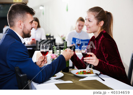 Elegant female and her boyfriend are celebrating date for dinner 40334659