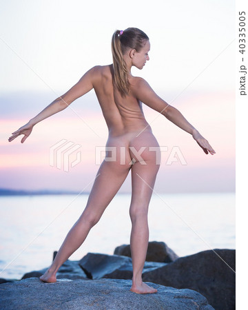 Active sporty naked female doing aerobics 40335005