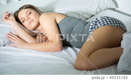 Portrait of relaxed girl in pyjamas sleeping in bed Portrait of relaxed girl in pyjamas sleeping in bed 40335193