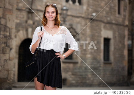 girl walking at the street among architecture girl walking at the street among architecture 40335356