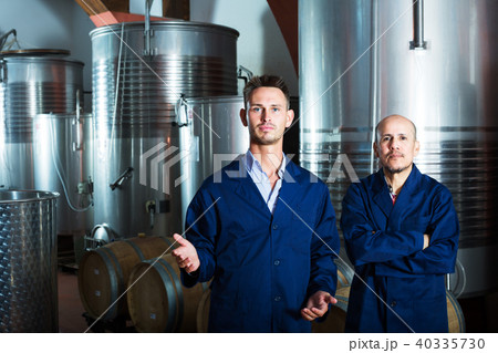 two coworkers in wine factory 40335730