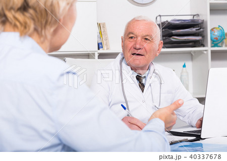Male doctor with female client Male doctor with female client 40337678