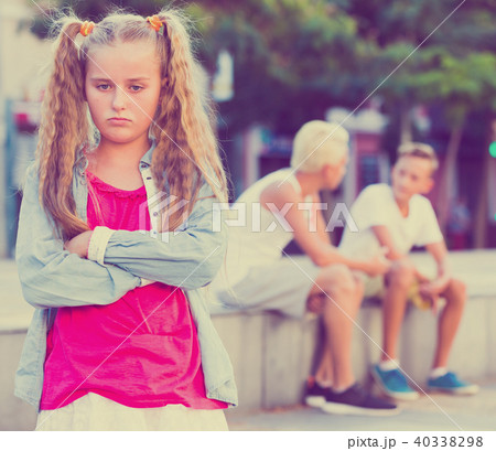 Upset girl after quarrel with playmates 40338298