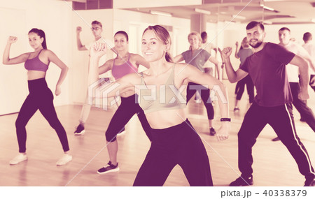 Women and men dancing in dance school 40338379
