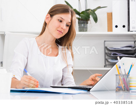 Young business woman at workplace Young business woman at workplace 40338518