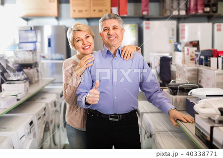 Husband and the wife are satisfied with wide range of household appliances Husband and the wife are satisfied with wide range of household appliances 40338771