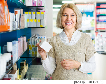 Female customer in pharmacy drugstore . Female customer in pharmacy drugstore . 40339088