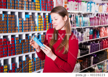 Female buying hair dye 40339223