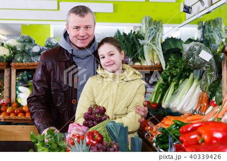 Portrait of positive preteen girl with father 40339426
