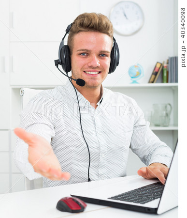 Portrait of young businessman with headset Portrait of young businessman with headset 40340098