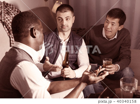 Three men are drinking beer and talking about life in time rest Three men are drinking beer and talking about life in time rest 40340158
