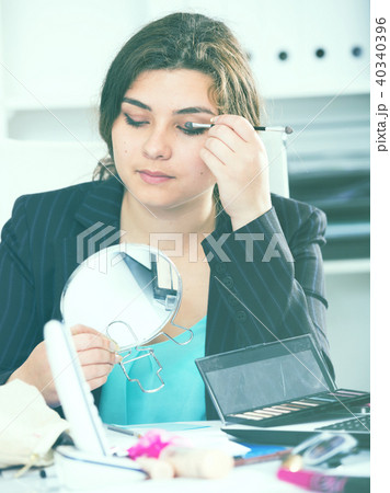 Beginner manager is making makeup before meeting Beginner manager is making makeup before meeting 40340396