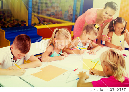 Positive children drawing on lesson in class 40340587