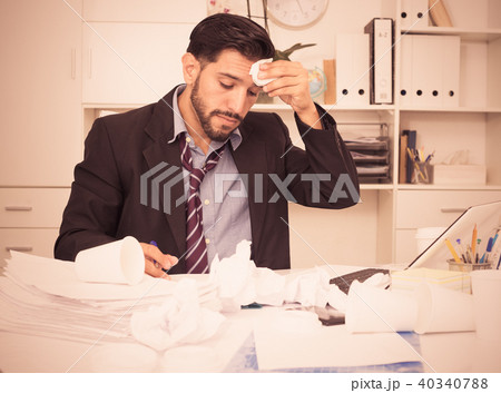 Adult businessman is sad because he is having issues at work place 40340788