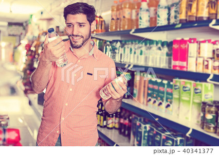 man is consumering bottles with water man is consumering bottles with water 40341377