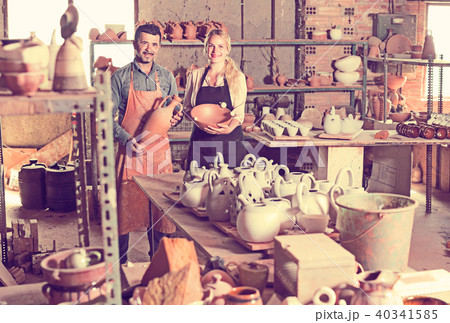 Two glad craftsmen with ceramic 40341585