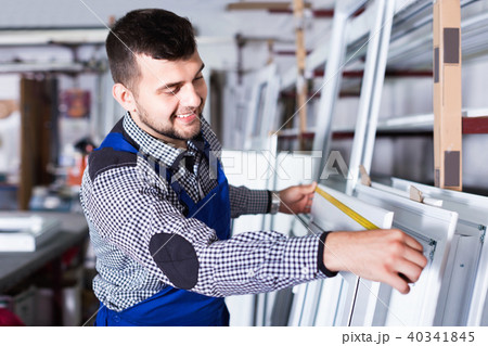 Professional labour with finished PVC profiles and windows at factory Professional labour with finished PVC profiles and windows at factory 40341845