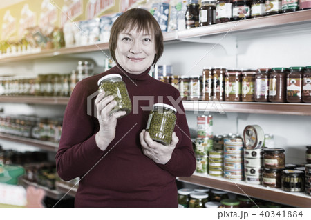 woman buyer shopping canned jar of peas woman buyer shopping canned jar of peas 40341884