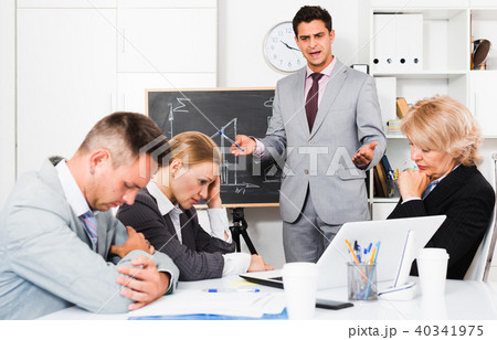 Manager expressing dissatisfaction with colleagues 40341975