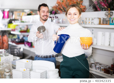 Couple buys utensils for a house Couple buys utensils for a house 40342335