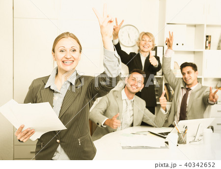 Happy business group with woman at office 40342652