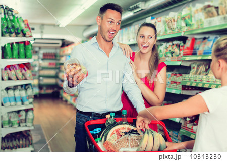 Family standing with purchases 40343230