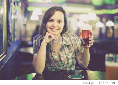 girl in bar with beer 40344139