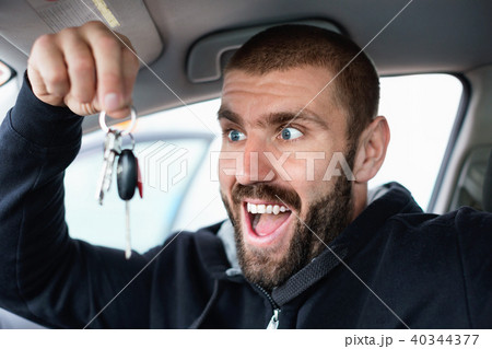 Man shows keys from new car 40344377