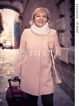 portrait of mature female with baggage portrait of mature female with baggage 40344541