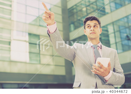 Businessman pointing at something 40344672