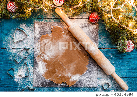 Photo of rolling pin, dough, spruce branches, garlands 40354994