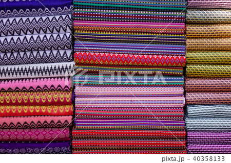 Colorful textile for sale at a street market 40358133