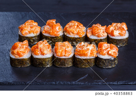 Futomaki sushi rolls topped with salmon, delicious Japanese food 40358863