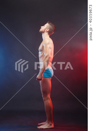 Side view of young muscular fit man with perfect body, vertical Side view of young muscular fit man with perfect body, vertical 40359673