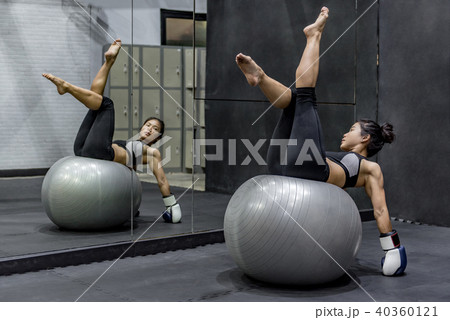 Young Asian athlete woman doing pilates exercises with exercise 40360121