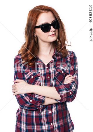 Young girl with arms crossed in plaid shirt Young girl with arms crossed in plaid shirt 40362816