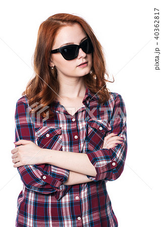 Young girl with arms crossed in plaid shirt Young girl with arms crossed in plaid shirt 40362817