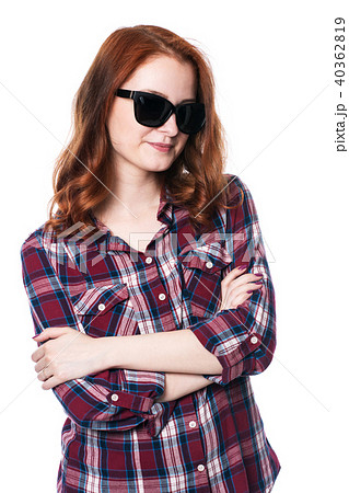 Young girl smiling with arms crossed in plaid  40362819