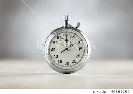 Analog stopwatch on grey background Analog stopwatch on grey background 40365266