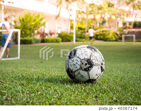 Old ball whit mini goal football and players 40367174
