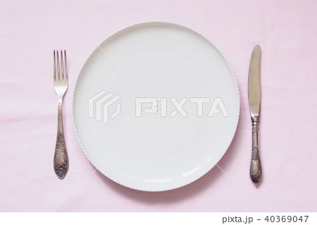 Table place setting on pink linen tablecloth. Table place setting on pink linen tablecloth. 40369047