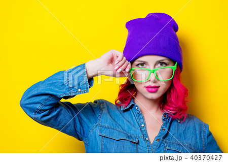 girl in blue shirt, purple hat and green glasses 40370427